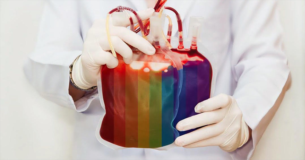 Doctor holding bag of blood with pride colours