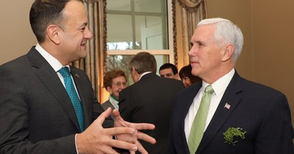 Leo Varadkar meeting Mike Pence in a busy room.