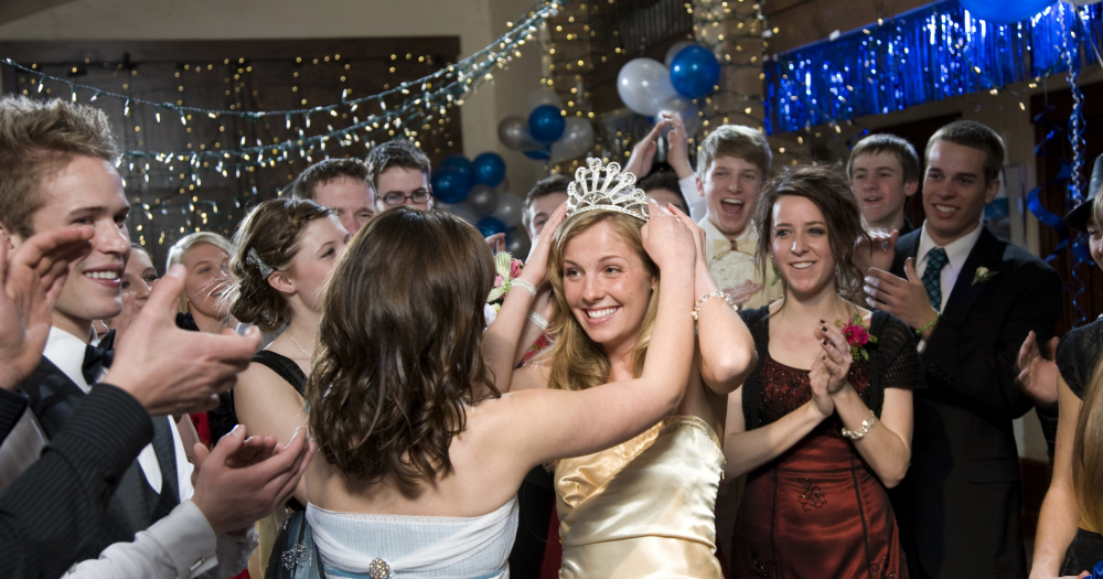 A girl is crowned at her high school prom.