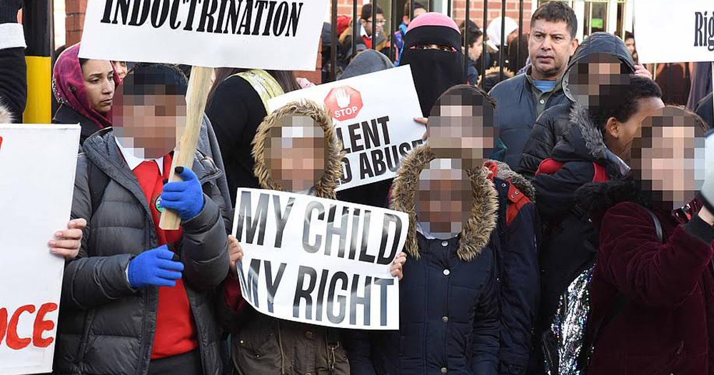 Protestors picket outside the school over LGBT+ lessons