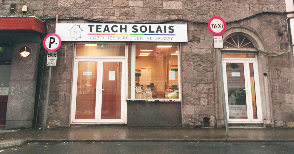 The exterior of the Teach Solais Building, a stone building with warm inviting windows