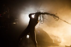 In a promo for Nightclubbing, a figure backlight by strong lights whips around a long plait seemingly made of wires