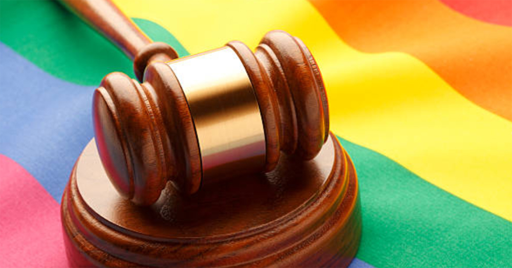 A gavel on a rainbow flag, celebrating the victory in a Russian court