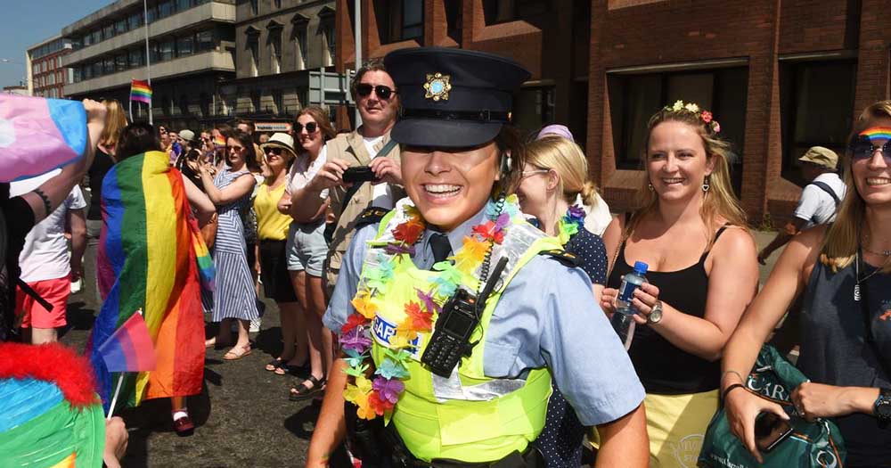 A female member of the gardaí at Pride dressed in rainbow accessories