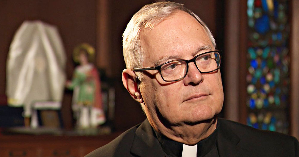 Catholic Bishop Thomas Tobin sits in a church as the community condemn his actions