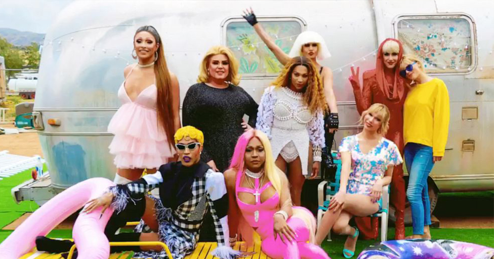 taylor swift stands with 5 drag queens in front of vintage trailer