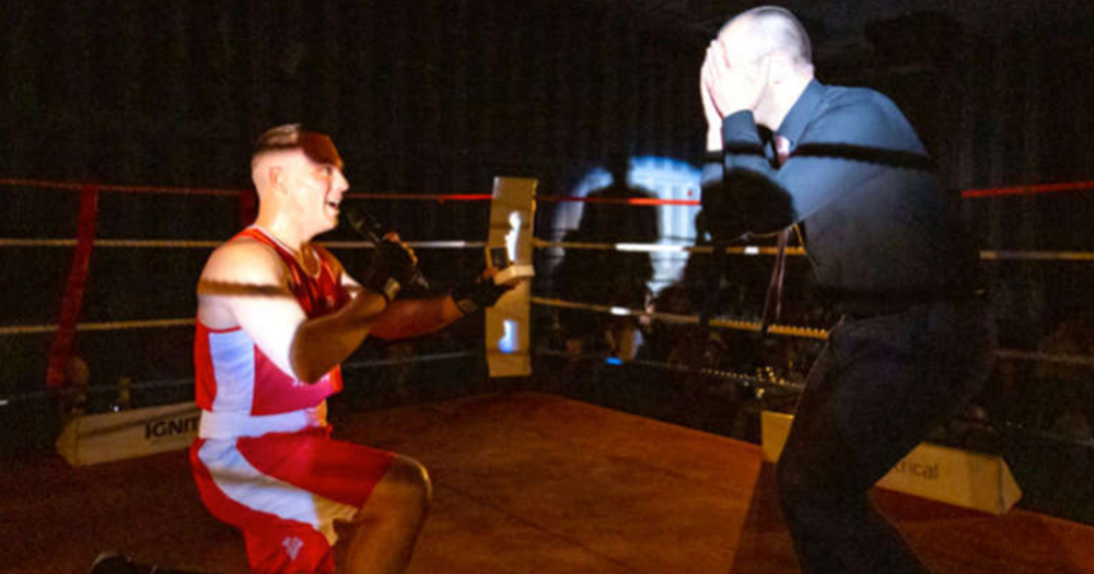 boxer proposes to partner on one knee in boxing ring
