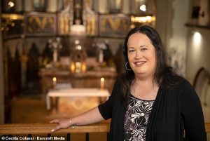 Ms. Cacace, former transgender catholic priest, stands in Church