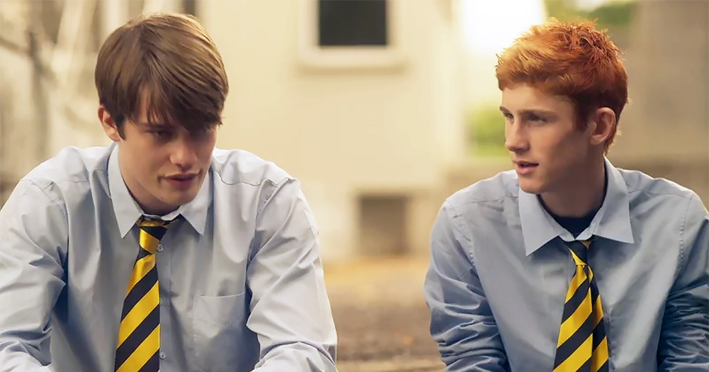 Handsome Devil characters Ned (Fionn O’Shea) and Conor (Nicholas Galitzine) sitting outside in school uniforms