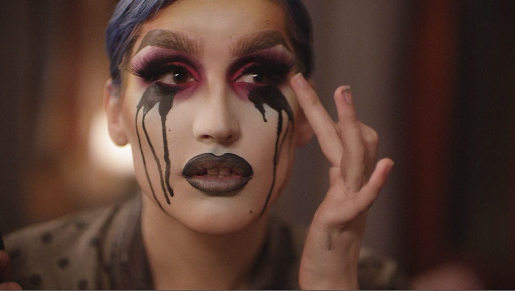 Still from documentary Deep in Vogue: a drag queen doing her make-up.