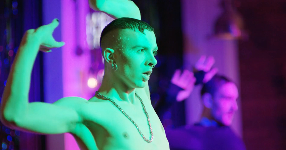 Still from documentary Deep in Vogue: a shirtless man voguing