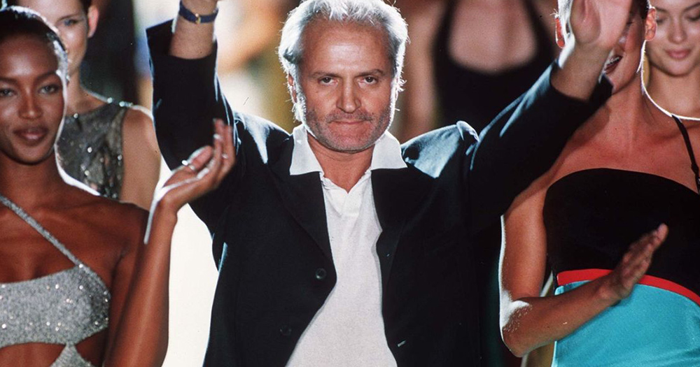 Gianni Versace celebrates after fashion show