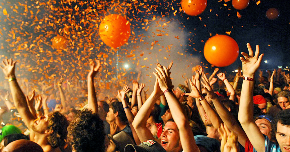Crowd at a music festival, balloons and confetti in the air. In this piece Lisa Connell speaks about new music festival Love Sensation