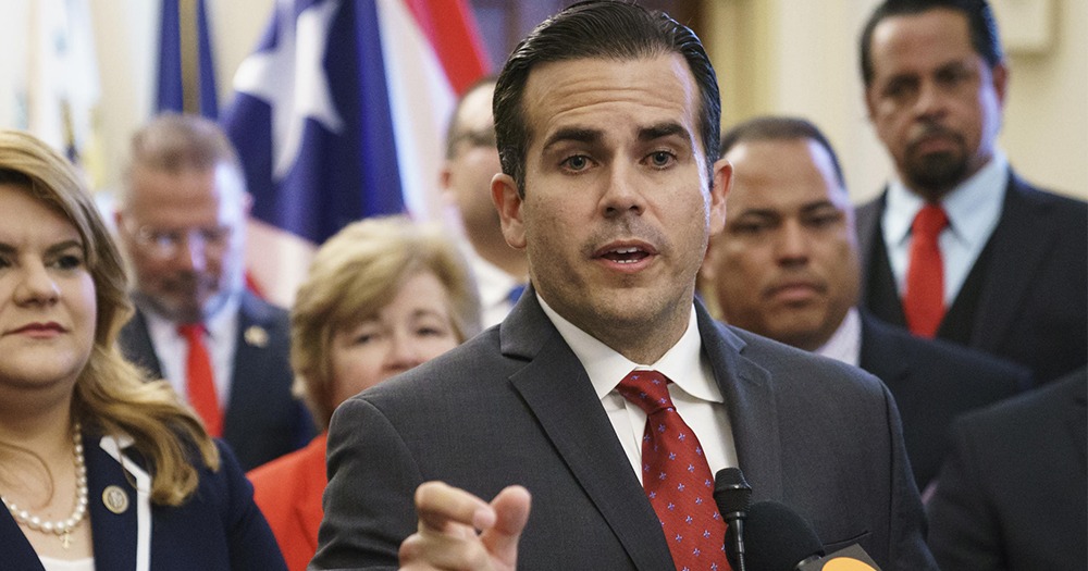 Puerto Rico governor Ricardo Rosselló in a suit at a press conference