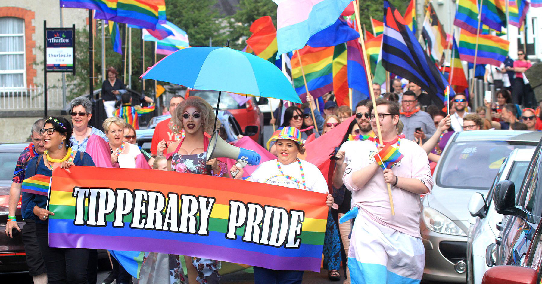 Thurles town centre filled with revellers as a Parade of LGBT+ people march, waving flags and holding banners