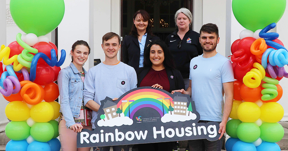 Students and staff at the University of Limerick pose with rainbow decorations to launch the rainbow housing initiative