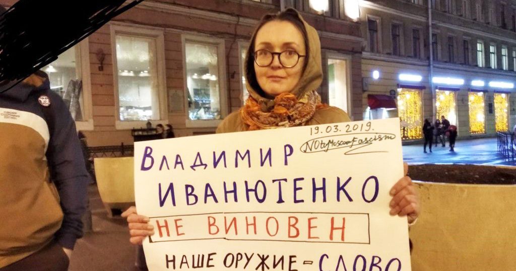 Yelena Grigoryeva holding a placard at a protest