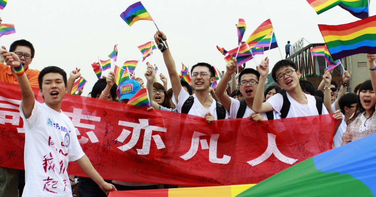 Chinese gay rights campaigners parading rainbow flags