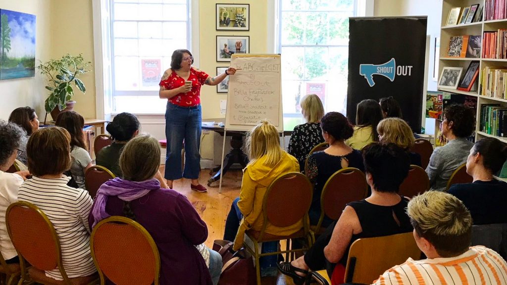 A Shout Out facilitator giving a class