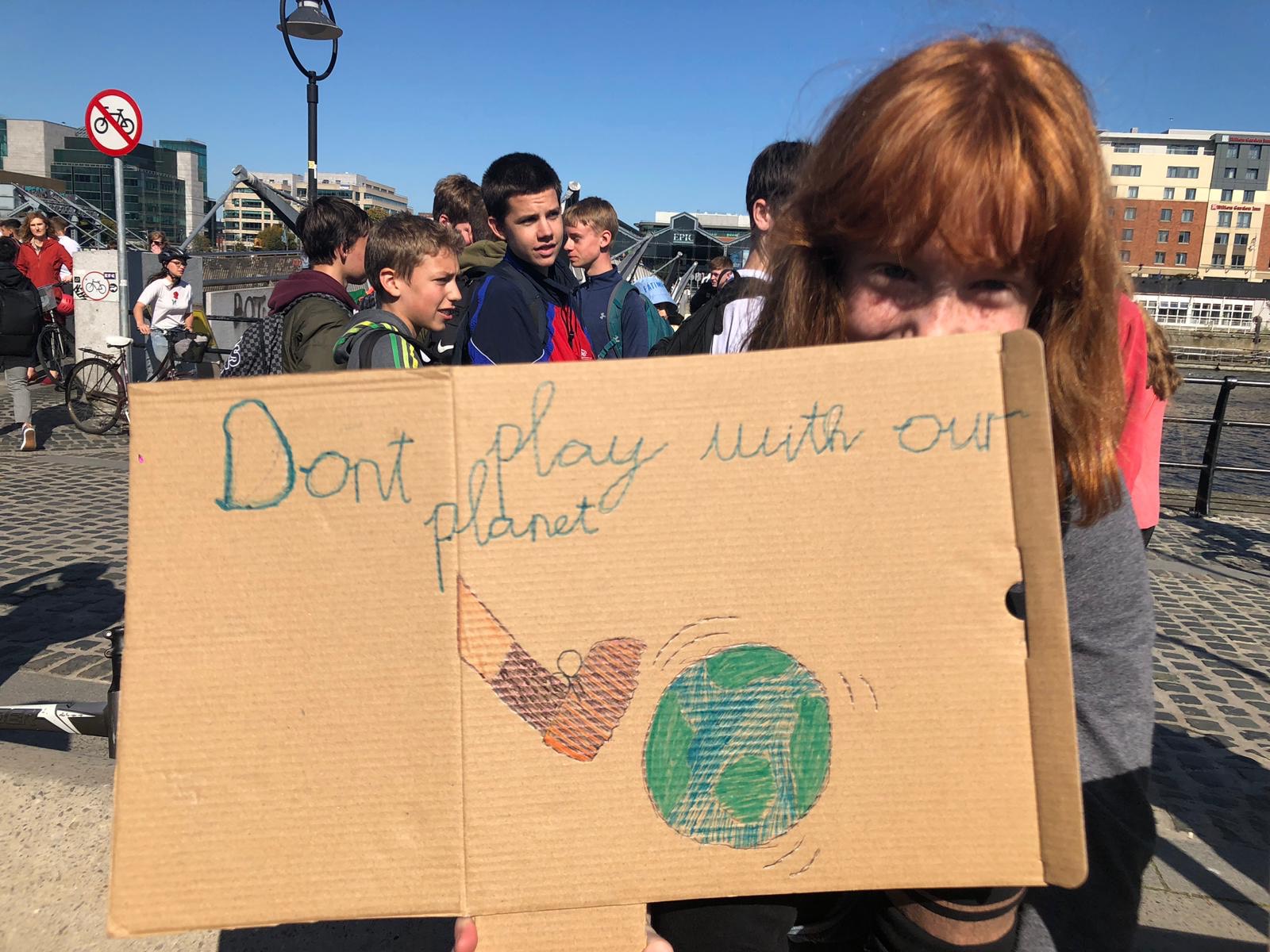 Young people holding signs as part of Dublin's contribution to the global climate protest.