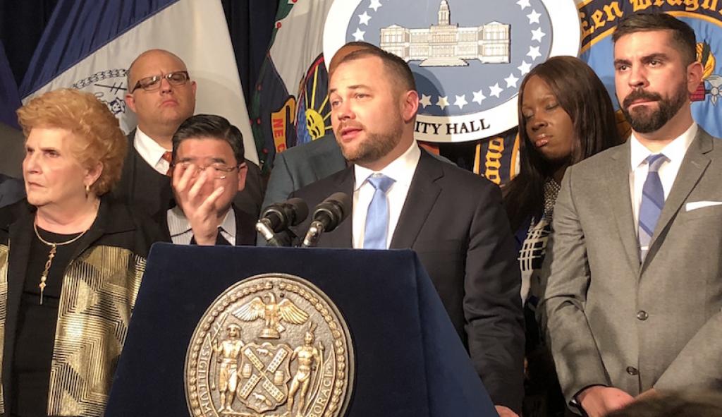 Corey Johnson speaks to a crowd at New York City Hall regarding change to conversion therapy ban