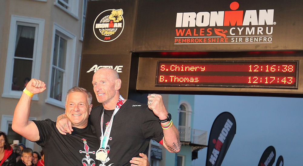 Gareth Thomas with his husband at the finish line hours after revealing he is HIV Positive