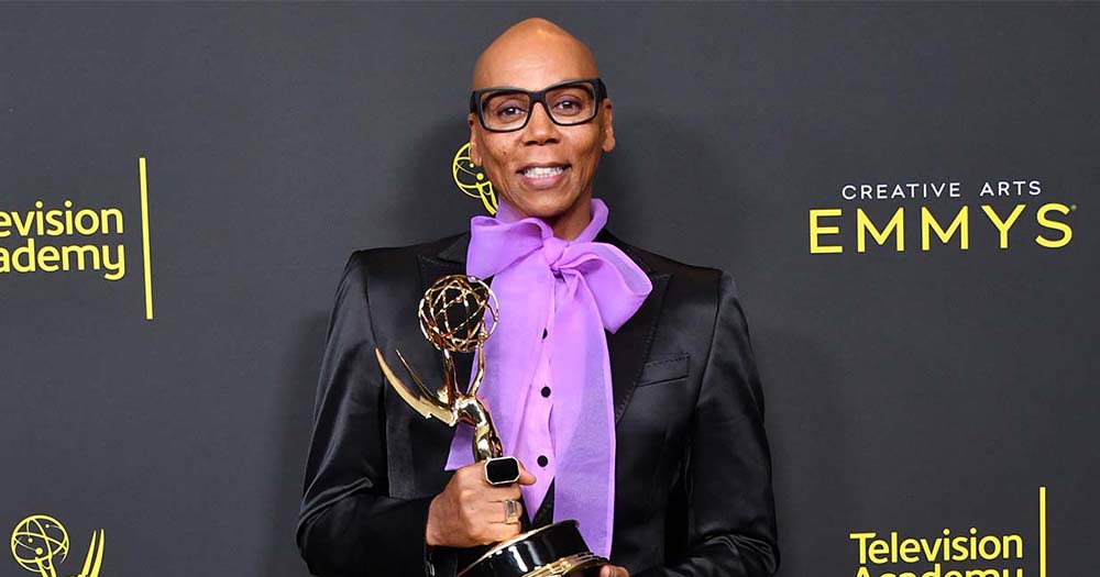 RuPaul, one of the Emmy winners dressed well holding an award