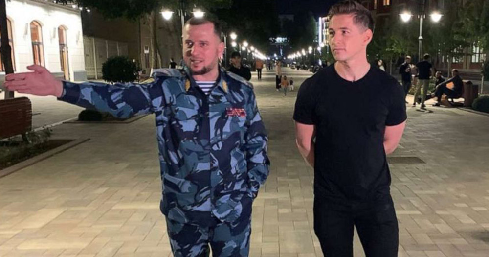 James Longman, wearing a black t-shirt, and Apti Alaudinov, wearing blue army uniform, walking around the capital of Chechnya.