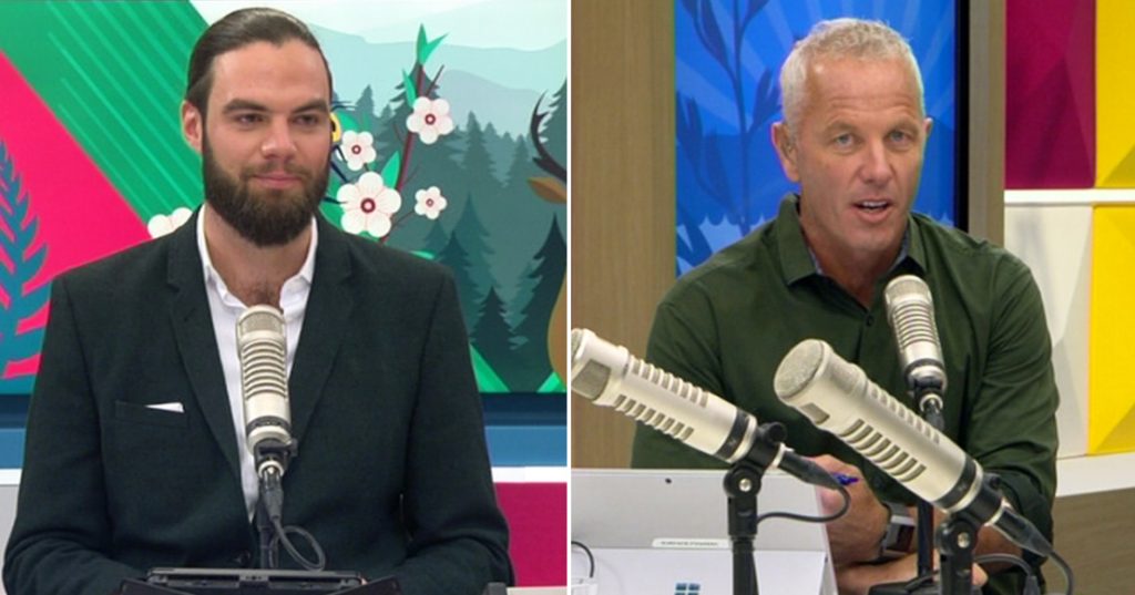 A split screen of two men in a TV news room, one looking annoyed, the other talking into a microphone