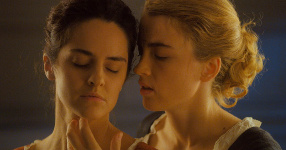 Two female characters from Portrait of a Girl on Fire embracing. It is part of the IFI French Film Festival lineup.