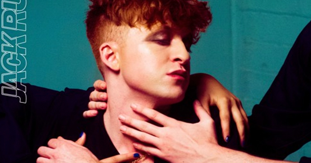 Image from Jack Rua's new single. A man with red hair is centre of the image, there is a close up of his face with his eyes closed. Various hands are holding him by the neck in a gentle fashion.