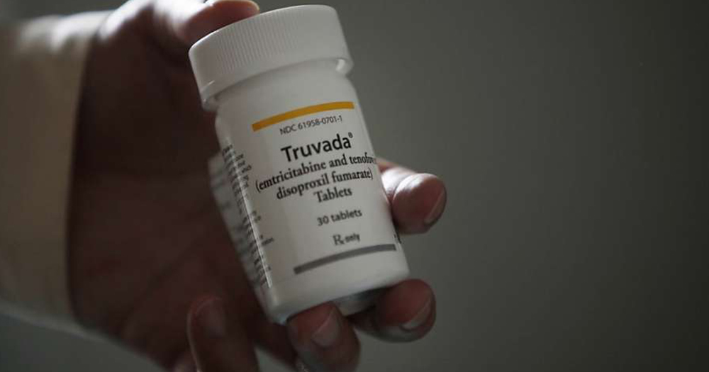 A hand holding a bottle of Truvada. As part of an ad on Facebook, PrEP is being promoted as having negative side effects.