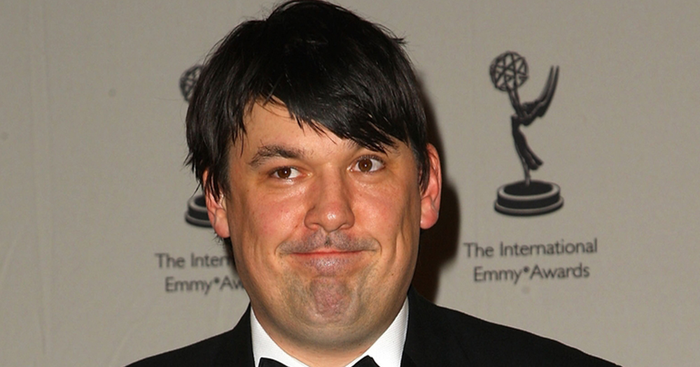 Graham Linehan smiling at the Emmy's. He has recently nominated for D*ck of the Year award.