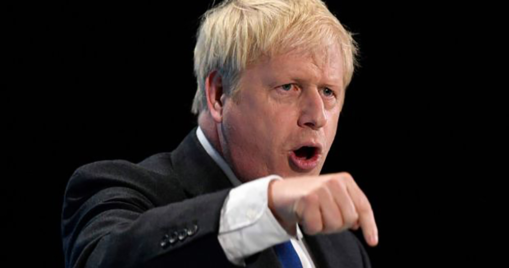 Boris Johnson looking angry and pointing downwards, his party won an overwhelming majority in UK general election.