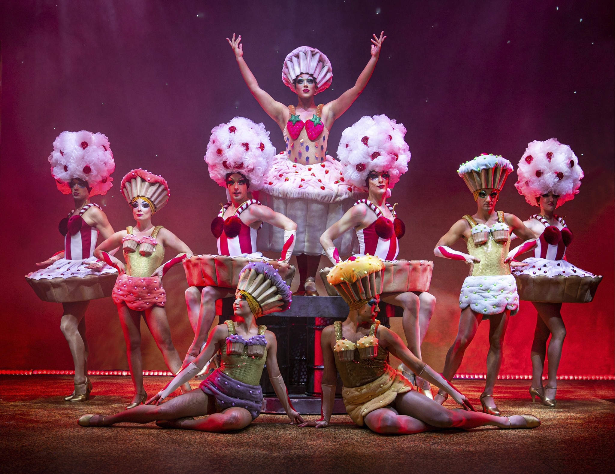 Performers wearing cupcake themed dresses in a song for Priscilla Queen of the Desert