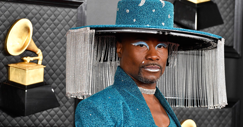 Billy Porter wearing a blue wide rimmed hate with crystal fringe at the Grammy Awards 2020
