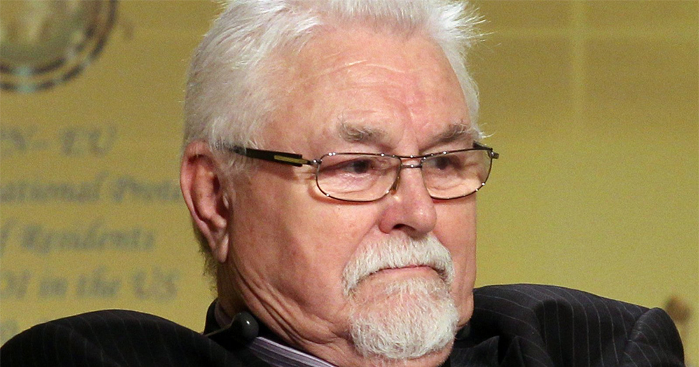 Ken Maginnis - an older white haired man wearing glasses sits with a grumpy expression on his face