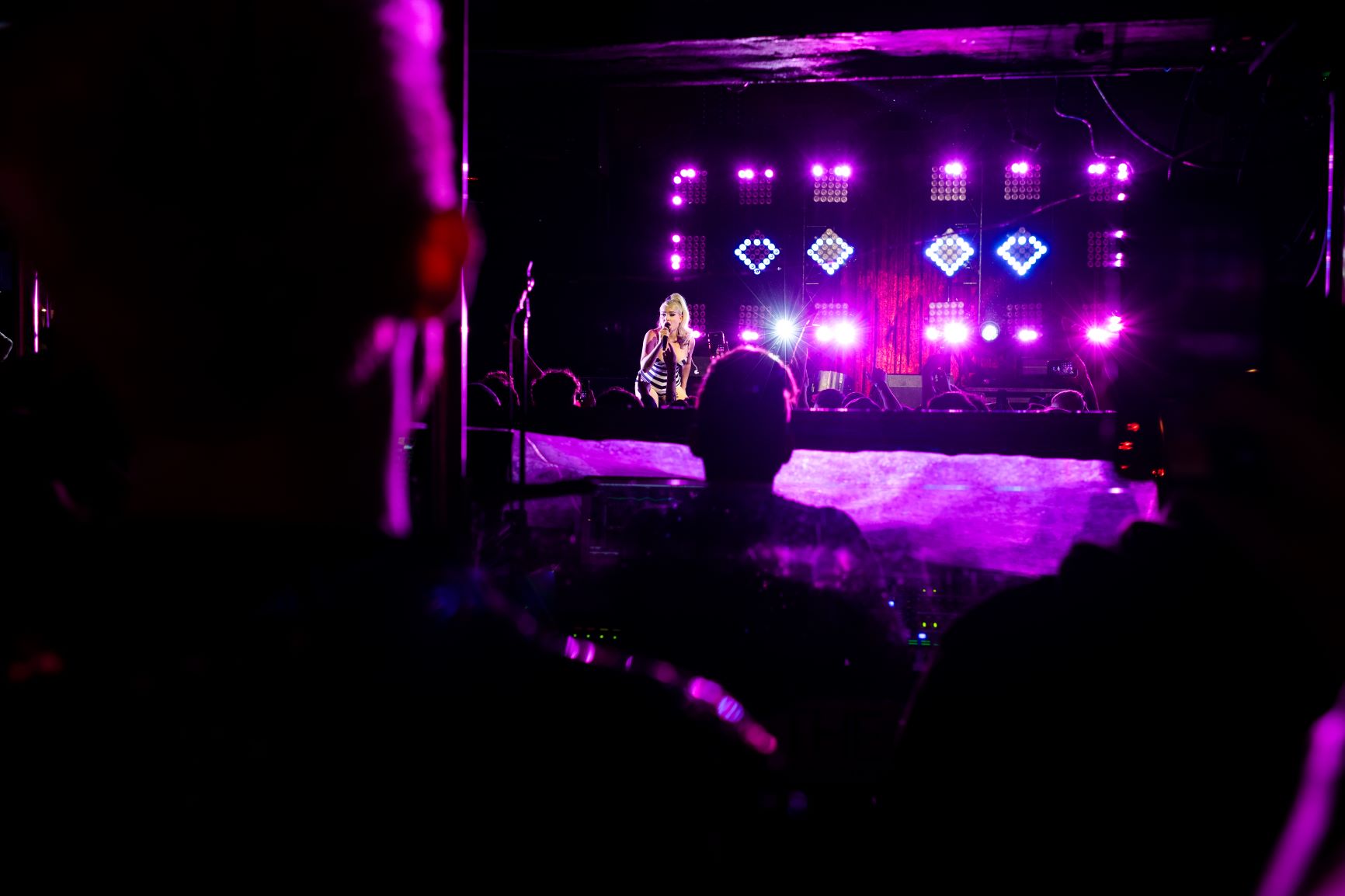 Kim Petras lying on stage in one piece. Image by Babs Daly.