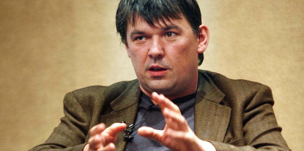 Graham Linehan with his hands up and looking confused