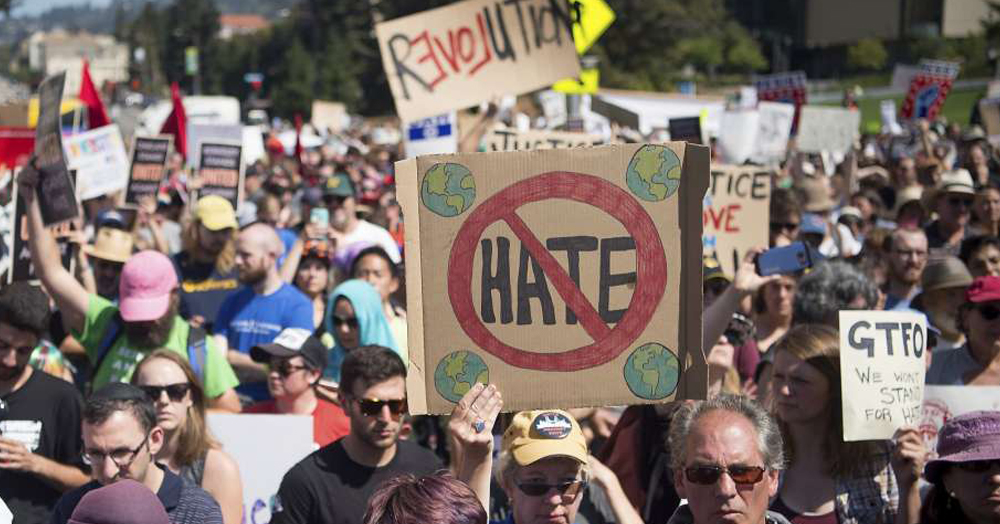 People protesting against hate crime.