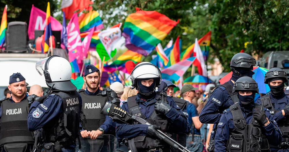 Armed police walking ahead of a Polish Pride parade, it was undercover police which found the explosives made by the married couple