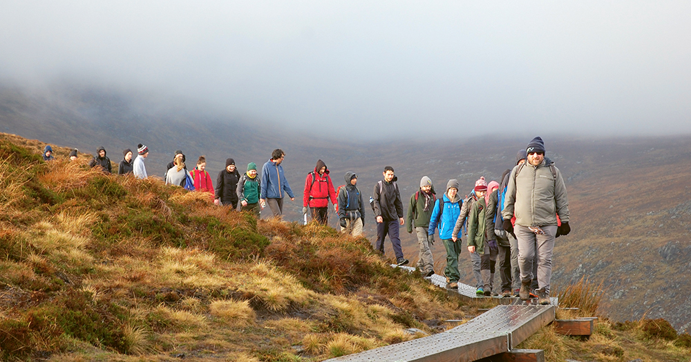 A group of people from Wet and Wild hicking.