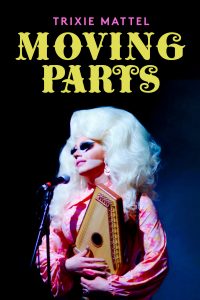 A country and western style drag queen plays an autoharp
