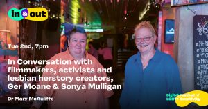 Two middle aged women pose inside a pub for a photo