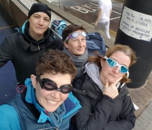 A group of women in sports jackets smiling