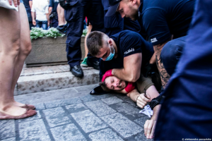 Scene of a mass arrest in Poland as police drag protestors away