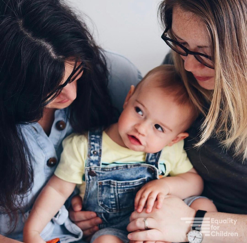 Equality for Children campaigners who met with Roderic O'Gorman: two mothers and their child, smiling