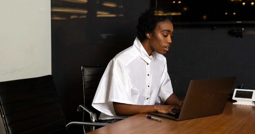 Non-binary Equality Act A non-binary person using a laptop at work