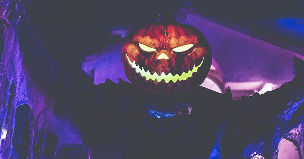 A pumpkin with a light up monster face