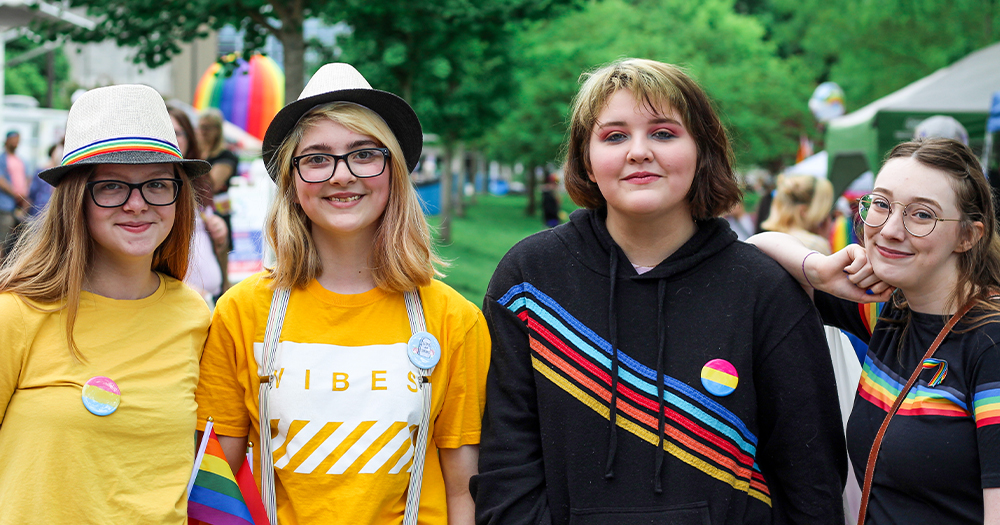 Four young girls celebrating Pride